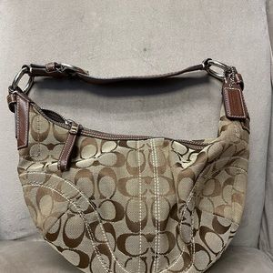 Flirty small Coach bag.